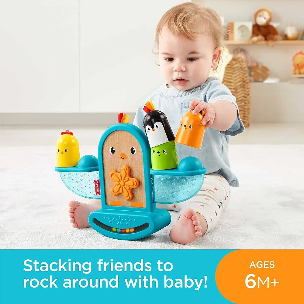 Baby playing with the Fisher-Price Stack and Rattle Birdie stacking toy on the floor