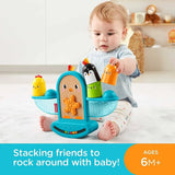 Baby playing with the Fisher-Price Stack and Rattle Birdie stacking toy on the floor