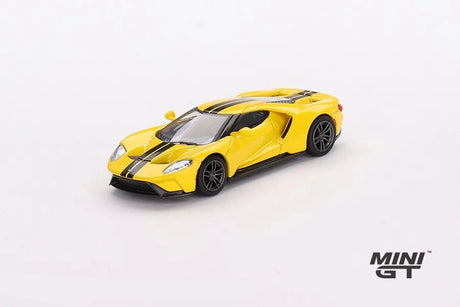 Ford GT Triple Yellow viewed from the front left showing the black centre stripes, headlights, front grille openings and sculpted side intake