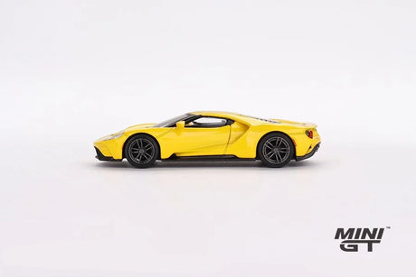 Mini GT Ford GT Triple Yellow LHD model in full left side profile showing the low body, large side intake, dark wheels and black lower trim