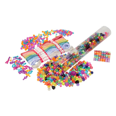 Friendship Bracelet set contents laid out with rainbow threads, alphabet cubes and assorted multicoloured beads