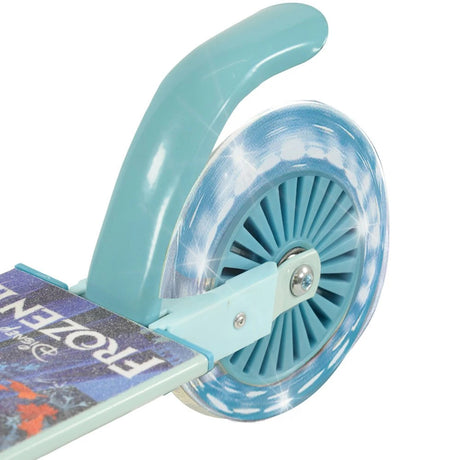 Close-up of the Disney Frozen Folding Inline Scooter rear teal light-up wheel showing sparkle light effect, teal mudguard and Frozen II printed deck edge