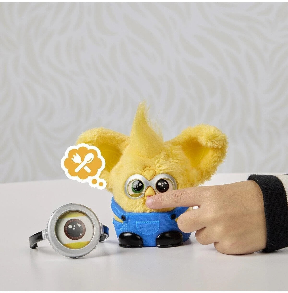 Furby Furblets Minions plush toy with mouth button being pressed