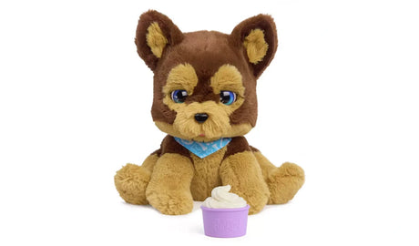 FurReal Benny the Kiss and Cuddle Pup seated with purple treat cup