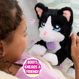 FurReal Boots the Biscuit Making Kitty kneading while held by a child