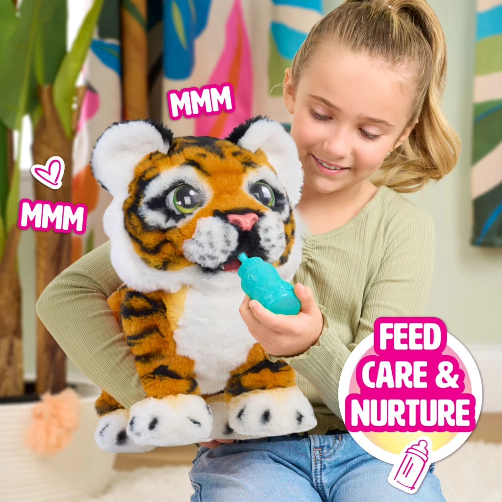 Child feeding FurReal Gabby the Grow & Roar Tiger with the blue bottle