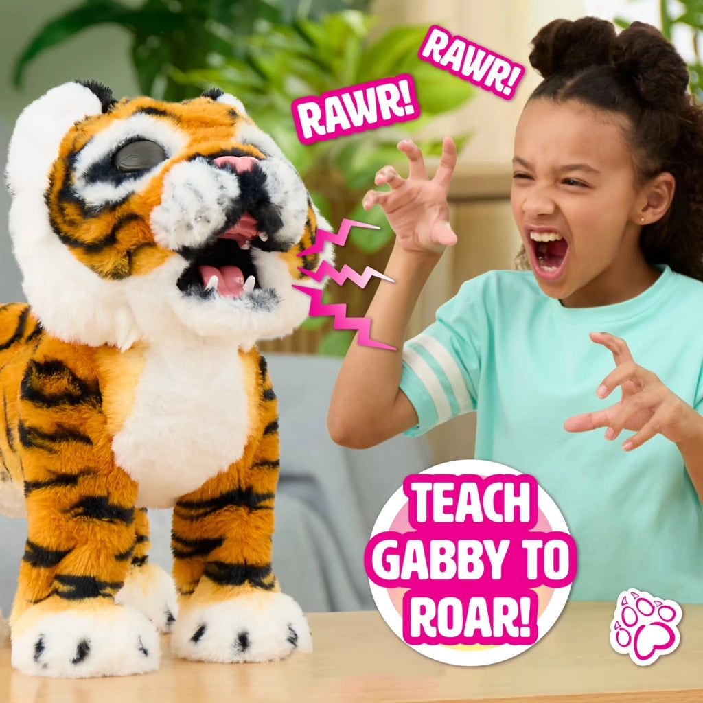 FurReal Gabby the Grow & Roar Tiger roaring beside child making a roaring gesture