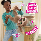 Child swinging FurReal Snuggles the Smiling Sloth by the arms and legs