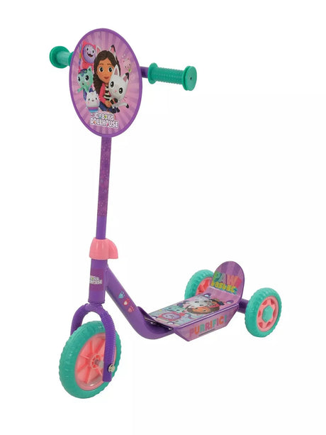Gabby's Dollhouse Deluxe Tri Scooter full view showing purple frame, teal wheels, character handlebar disc and decorated footdeck