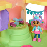 Gabby figure beside blue and purple fabric butterfly pieces inside the playset column