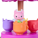 Gabby's Dollhouse Fairylandia Flutter-riffic Tea Party Playset with pink tea party decorations.