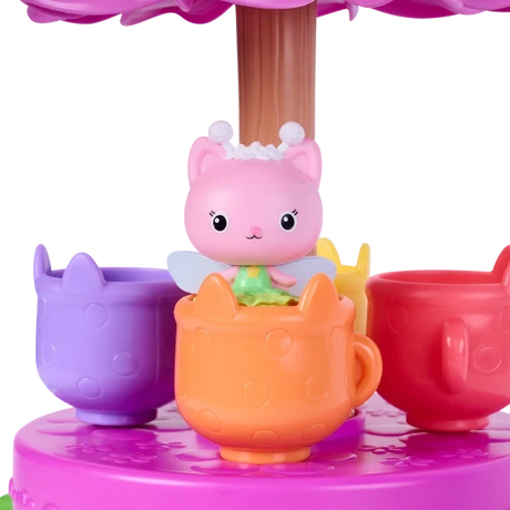 Gabby's Dollhouse Fairylandia Flutter-riffic Tea Party Playset with pink tea party decorations.