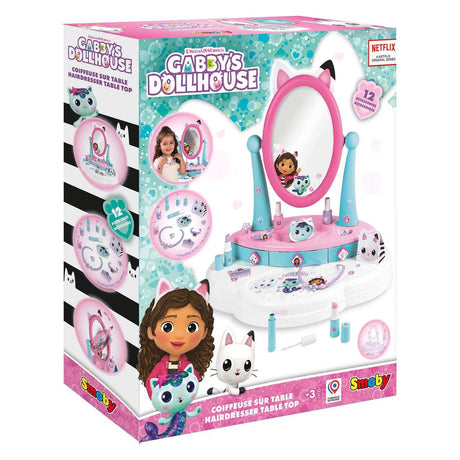 Smoby Gabby's Dollhouse Hairdresser Table Top in official packaging showing pink and teal vanity mirror with cat ear detail, 12 accessories and age 3+ rating