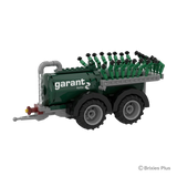 BRIXIES Plus Garant Kotte Vacuum Tanker viewed at an angle showing the green tank, tandem axle wheels, drawbar and folded spreading assembly