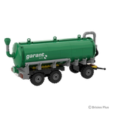 Front angled view of the BRIXIES Plus Garant Kotte Slurry Tanker showing the drawbar, front pipework, green tank body and three axle running gear