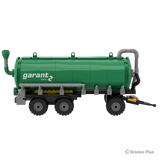 BRIXIES Plus Garant Kotte Slurry Tanker in left side profile showing the green cylindrical tank, Garant Kotte branding, triple axle layout and drawbar