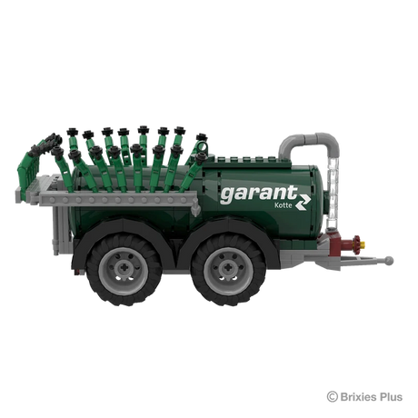 Side view of the BRIXIES Plus Garant Kotte Vacuum Tanker showing the Garant Kotte branding, green cylindrical tank, two axles and folded applicator