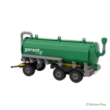 Rear angled view of the BRIXIES Plus Garant Kotte Slurry Tanker showing the rounded tank end, rear fittings, pipework and triple axle wheels