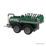 Rear angled view of the BRIXIES Plus Garant Kotte Vacuum Tanker showing the tandem wheels and folded green spreading equipment across the back