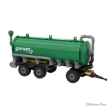 Garant Kotte Slurry Tanker BRIXIES model viewed from the right front side showing the tank body, side hose detail, drawbar and three axles