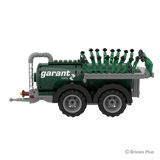 Opposite side profile of the Garant Kotte Vacuum Tanker BRIXIES model with the drawbar, tank body, pipework and tandem wheels visible