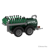 Garant Kotte Vacuum Tanker BRIXIES model viewed from the rear side with the spreading hoses folded upright above the tandem axle tanker