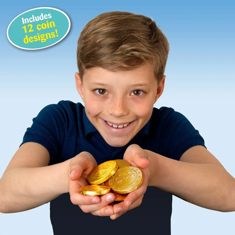 Boy holding several embossed golden chocolate coins in both hands with a callout stating that 12 coin designs are included