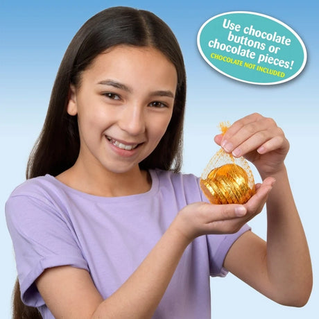 Girl holding a golden net bag filled with wrapped chocolate coins beside text stating to use chocolate buttons or chocolate pieces and that chocolate is not included