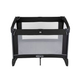 Graco Compact Travel Cot black and grey open top view with mesh sides and mattress visible