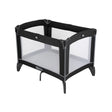 Graco Compact Travel Cot black and grey three quarter view with mesh sides and mattress