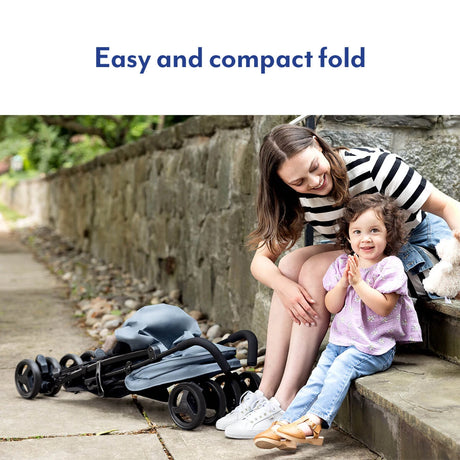 Graco EZLite Midnight stroller folded outdoors beside woman and child