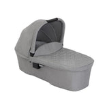 Graco Near2Me DLX carrycot shown separately with quilted grey fabric, padded mattress, protective apron and extendable canopy