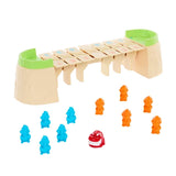 All components of the Greedy Gator board game displayed including bridge sections, figures, and red gator piece on white background