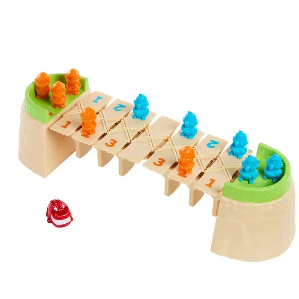 Greedy Gator board game set up with bridge platform, orange monkeys, blue parrots, and red gator roller underneath