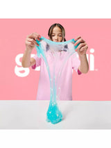 Gui Gui Deluxe Twin Pack teal clear shimmer slime stretched wide with white pearl beads embedded throughout, pulled upward from a white surface