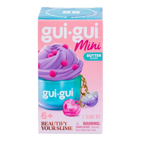 Gui Gui Mini Single front of box showing teal jar topped with purple butter slime and pink pompoms, with gold chain keyring charm featuring pink heart and purple acorn pendants