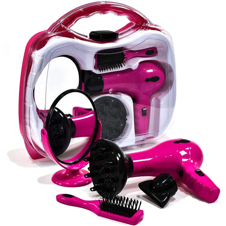 Pink toy hairdryer set laid out in front of its clear carry case, showing hairdryer, diffuser attachment, concentrator nozzle, hairbrush, and round mirror