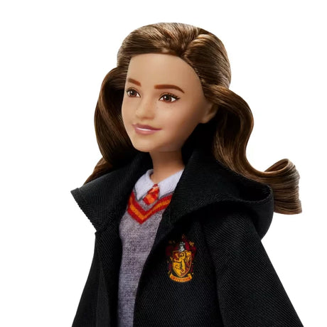 Close view of the Hermione Granger fashion doll with curled brown hair and Gryffindor robe
