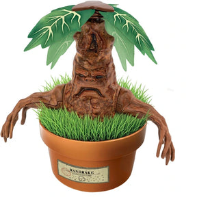 Finished Harry Potter Mandrake terrarium showing a brown Mandrake figure with outstretched root arms, large green leaves and grass growing in a brown pot labelled Mandrake.