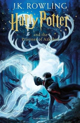 Harry Potter and the Prisoner of Azkaban book by J.K. Rowling, Bloomsbury edition, showing a glowing white stag patronus and a young wizard casting a spell in a dark forest