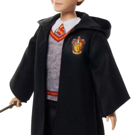 Close view of the Ron Weasley doll wearing his Gryffindor robe, school jumper and tie