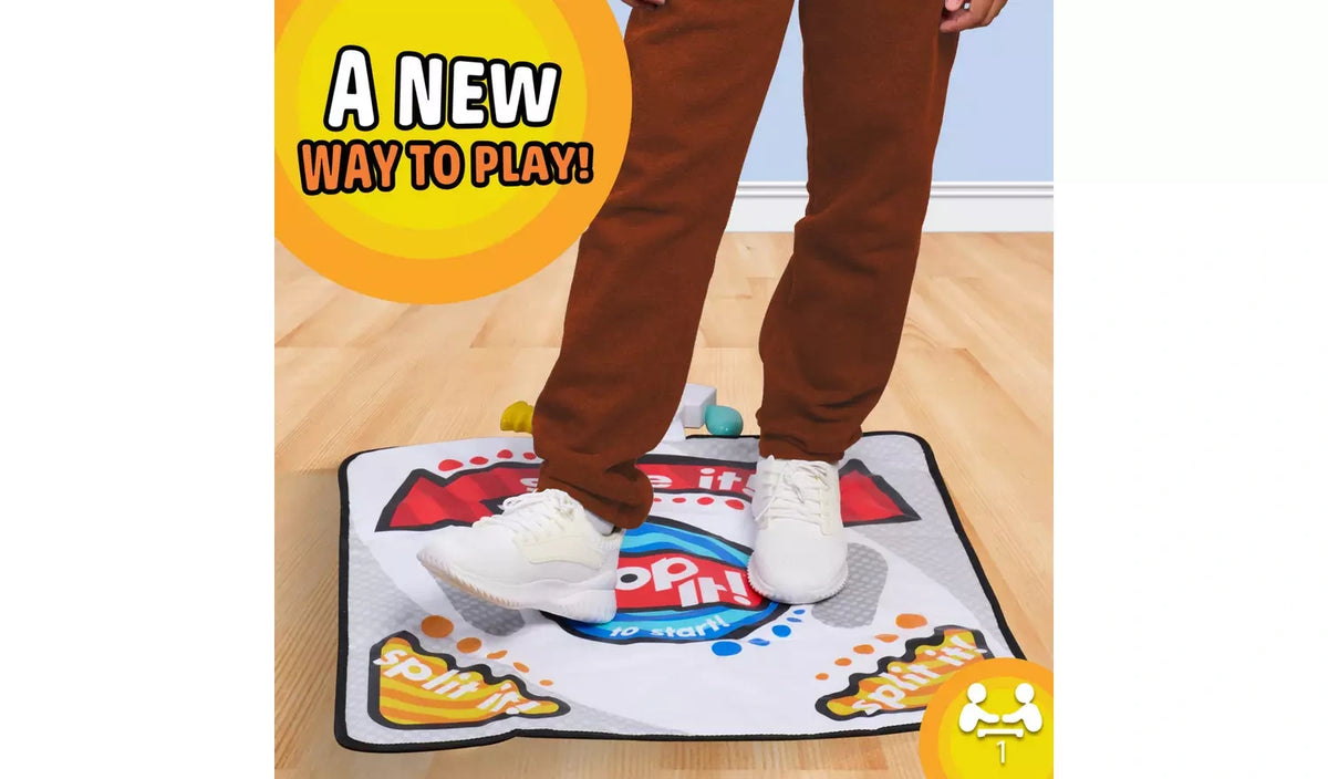 Player stepping on the Hasbro Bop It! Jump Game Mat during a game