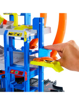 Hot Wheels Mega Loop Garage close-up of blue car lift with yellow platform and orange car