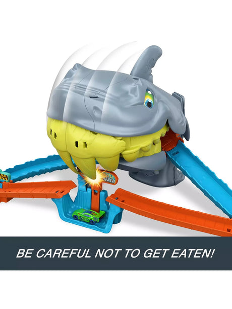 Hot Wheels City Shark Chomp Beach Playset with car positioned under the shark jaws