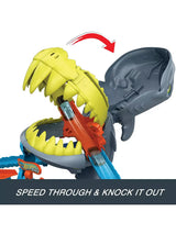 Hot Wheels City Shark Chomp Beach Playset with shark head knocked backwards and red arrow graphic