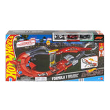 Front of the Hot Wheels Racing Formula 1 Downhill Circuit Race retail box showing the red and black track, three Formula 1 cars through a display window and Hot Wheels Racing branding.