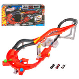 Hot Wheels Formula 1 Downhill Circuit Race track with red and black racing lanes, elevated curves, lap counter and three miniature F1 cars, displayed with its retail box on a white background.