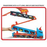 Hot Wheels Speedway Hauler unfolded into extended dual racetrack with cars displayed