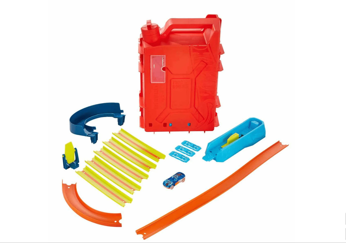 Hot Wheels Track Builder Fuel Can Stunt Box contents displayed with tracks, connectors, loop, and car in Ireland.