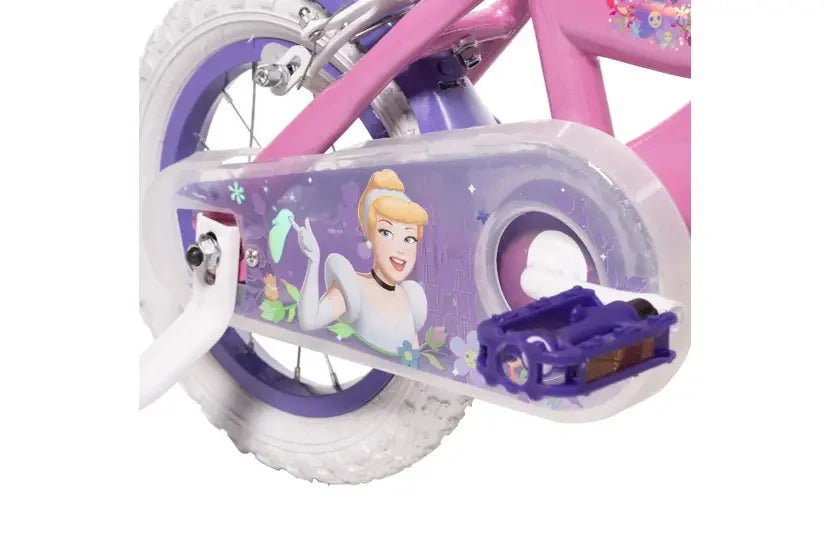 Close up of the Huffy Disney Princess bike chain guard with princess character graphic, purple pedal and rear wheel